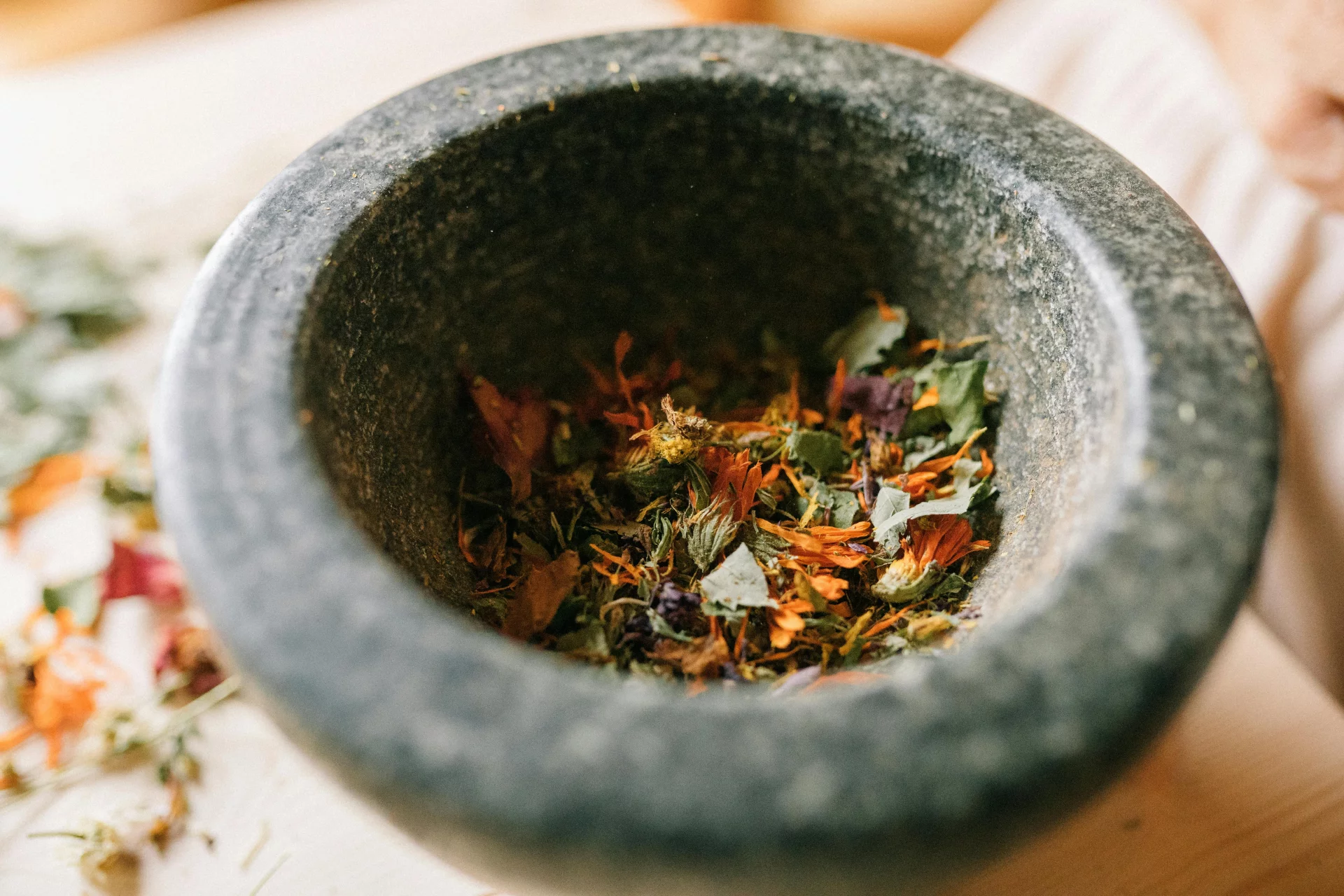 Fresh botanical ingredients, extracts, and pure water on a dark background