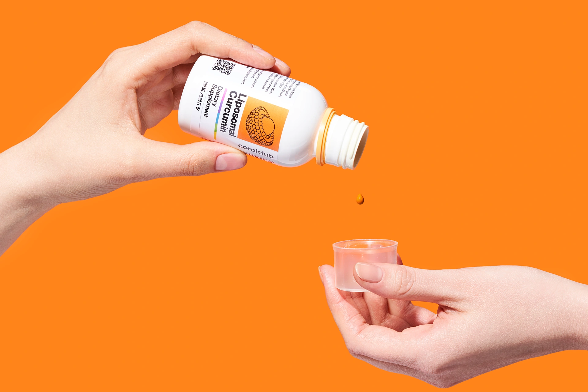 Measuring cap with a rich drop of liquid Liposomal Curcumin